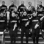 The 15 members of the UA band pose with director Dr. Gustav Wittig in 1915.