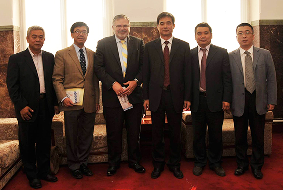 Robert Olin and Luoheng Han with representatives of Jilin Agricultural University in China