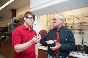 Dr. Anthony J. Arguengo III works with student Wesley Taylor.