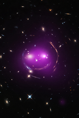 The x-ray image superimposed over the optical image creates the purplish smile of The Cheshire Cat Galaxy Group.