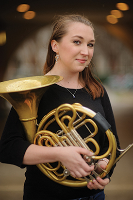 Cynthia Simpson, a graduate student in the School of Music, has played the horn since she was 10 years old. She is one of many UA students who have won or placed in international competitions. Photo Caption: Matthew Wood