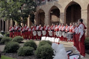 Members of the Million Dollar Band conclude the College’s annual homecoming celebration in Woods Quad by singing the Alma Mater.