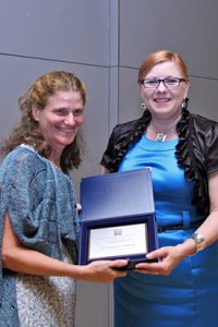 Dr. Marysia Galbraith, left, receives the Bronislaw Malinowski Social Sciences Award