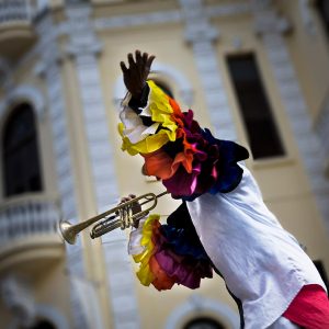 a trumpeter wearing a colorful shirt