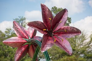 large metal sculpture of two flowers