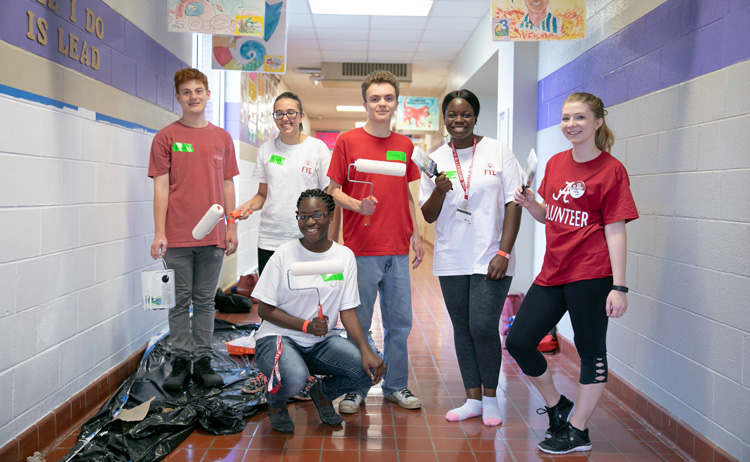 students participating in the Embrace Tuscaloosa service project
