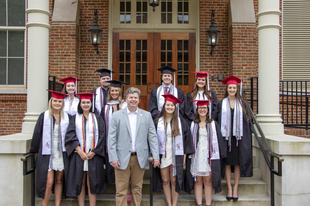 Ted Poston, Director of MPMS & Professor of Philosophy shown with McCollough graduates